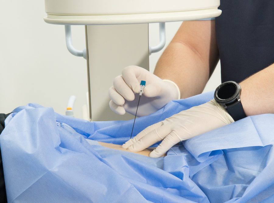 A,Medical,Professional,Gives,An,Injection,Into,The,Patient's,Arm